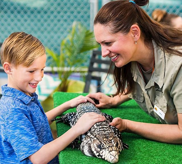 woman and child holding an animal